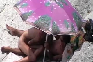 LesbianPornVideos Giving head on the beach Euro Porn