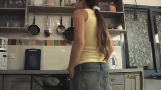 Shaved Emily teases in the kitchen Spank
